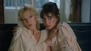 Brigitte Lahaie performs a classic lesbian scene in cozy bed